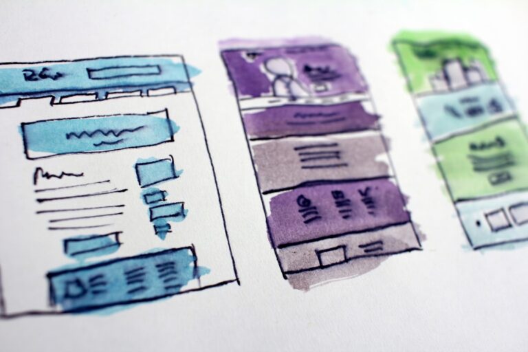 Design sketches and wireframes on a desk - planning custom Gutenberg blocks with ACF